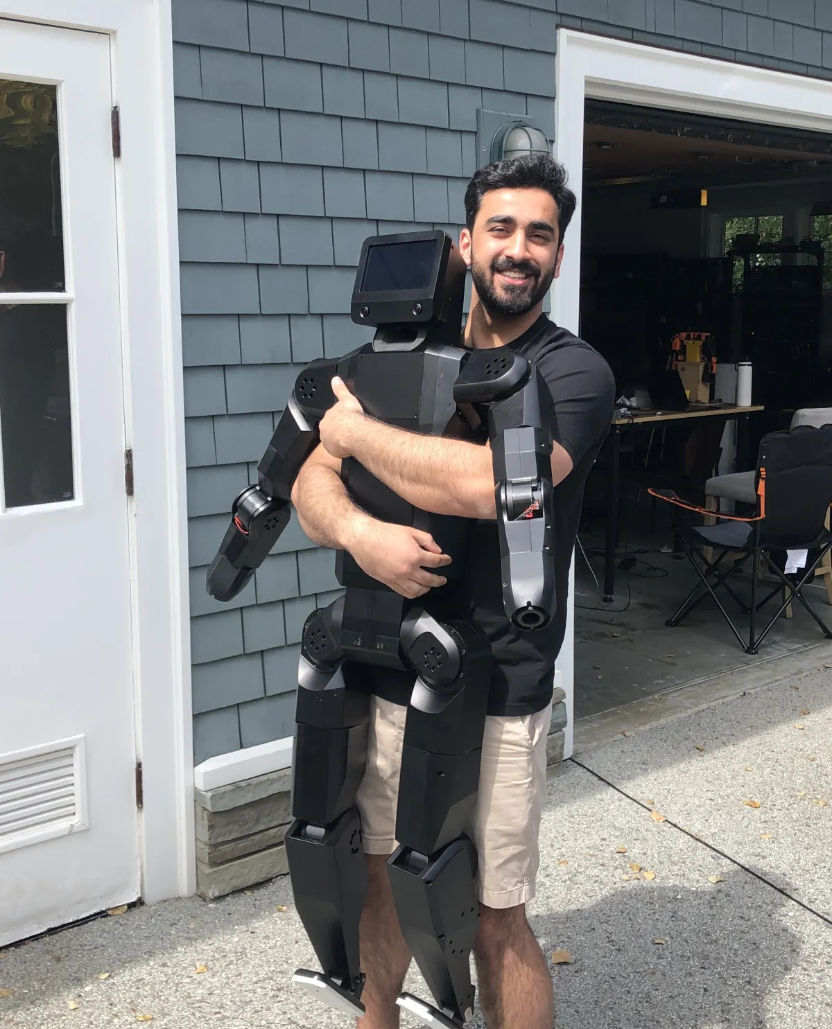 Haris carrying a humanoid robot